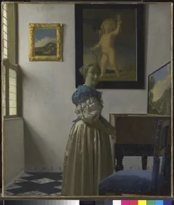 A Young Woman standing at a Virginal